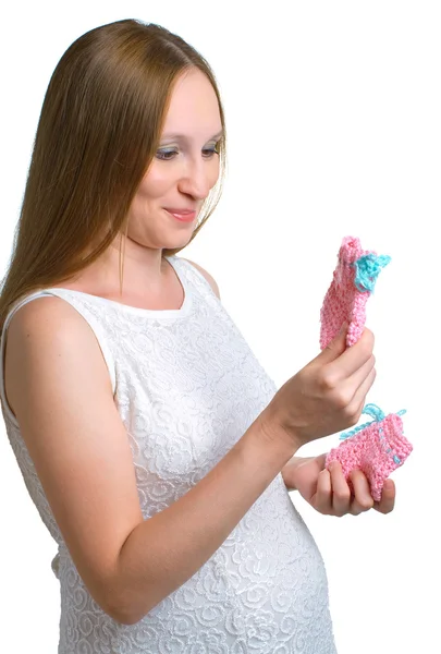 Těhotné ženy s rukama bootees — Stock fotografie