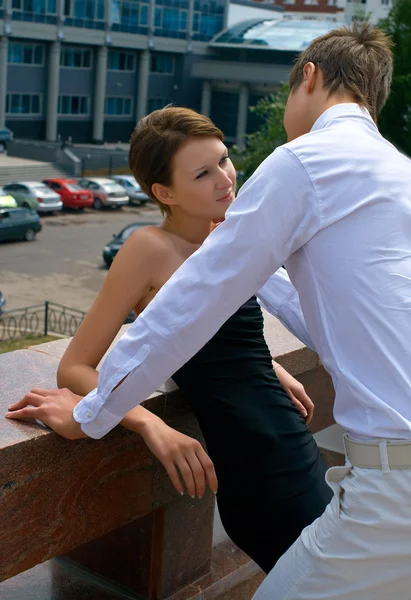 Beautiful girl and the young men — Stock Photo, Image
