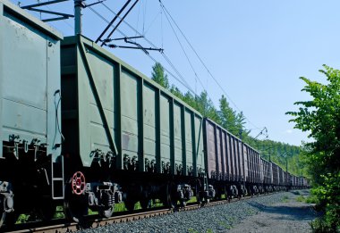 Rusty brown and green freight cars clipart