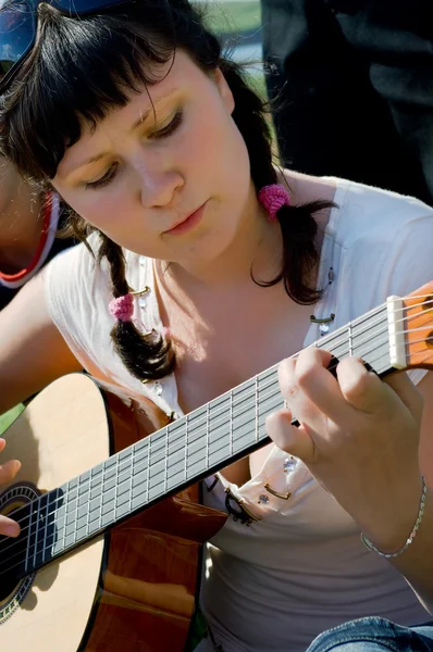 stock image Girl plays a guitar