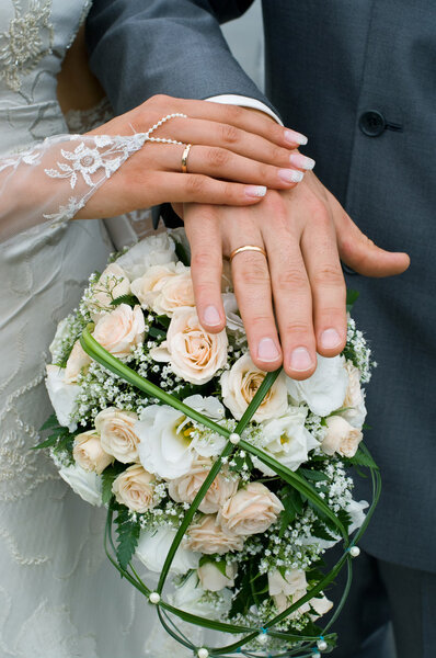 Hands of a newly-married couple