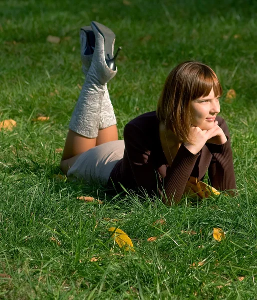 Girl on a green grass — Stock Photo, Image