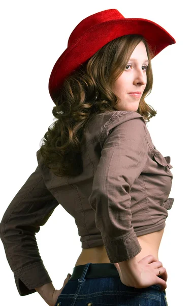 Meisje in een rode hoed en jeans — Stockfoto