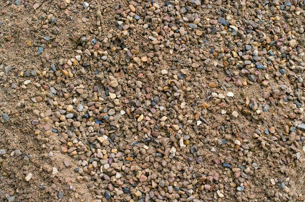 Sandy beach with small stones — Stock Photo, Image