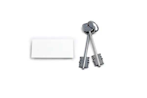 Домашні ключі і білий квадрат — стокове фото