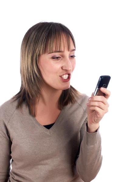 Молода жінка з мобільним телефоном ізольована на білому — стокове фото