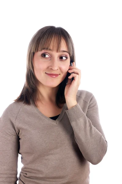 Молода жінка з мобільним телефоном ізольована на білому — стокове фото