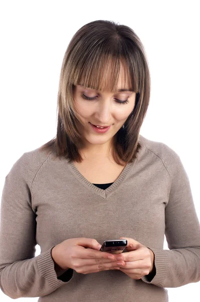 Молодая женщина с мобильным телефоном изолированы на Уайт — стоковое фото