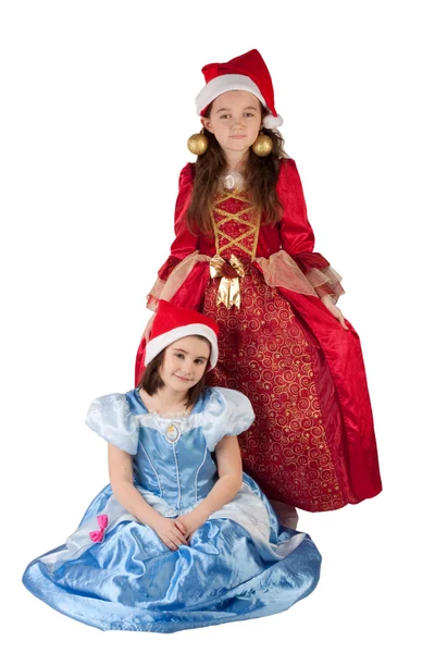 Twee meisjes met Kerstmis hoeden op — Stockfoto