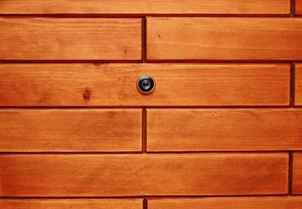 Peephole in woodden wall — Stock Photo, Image