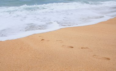 Footprints on the sand clipart