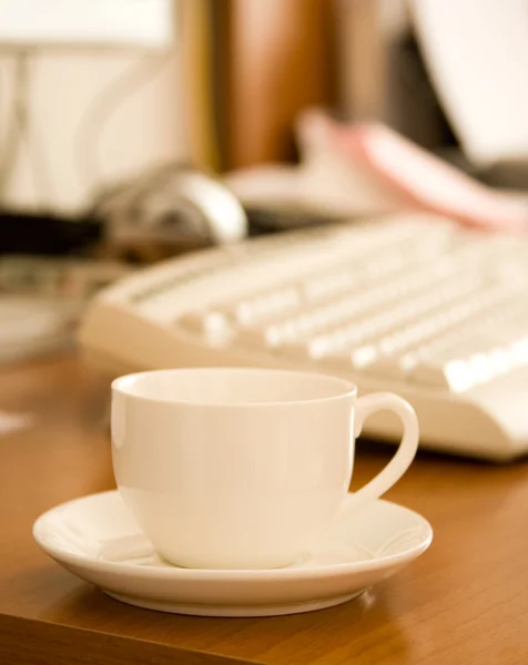 stock image Closeup of coffee cup near keyboard