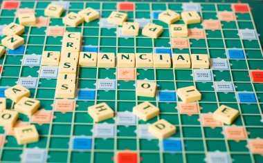 Letters of a board game forming the words Financial Crisis clipart