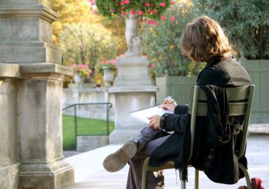 Girl drawing in the Luxembourg Garden clipart