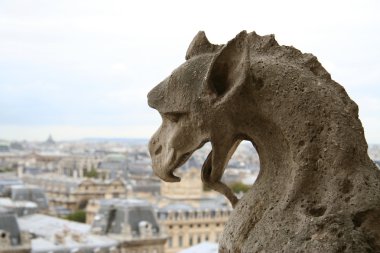 Close-up of gargoyles on the top of Notre-Dame de Paris clipart