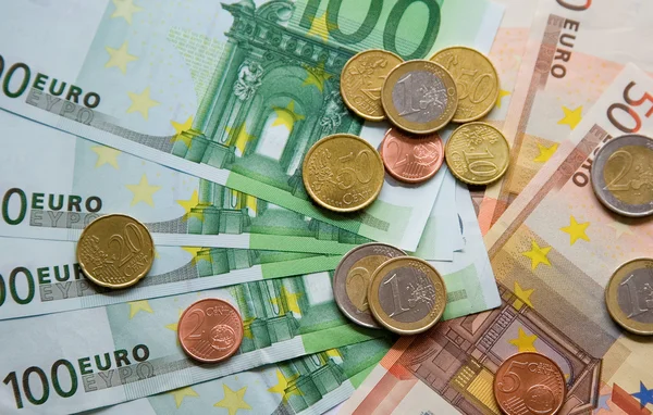 Euro banknotes and coins — Stock Photo, Image