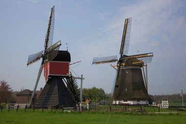 Two picturesque wind mills clipart