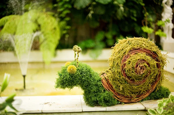 Garden decoration in form of funny snail — Stock Photo, Image