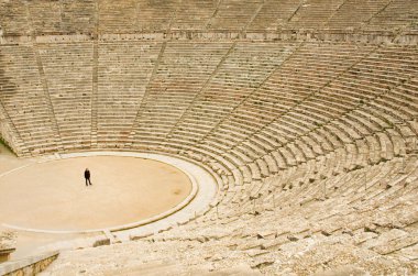 Tourist in ancient theater in Epidaurus clipart