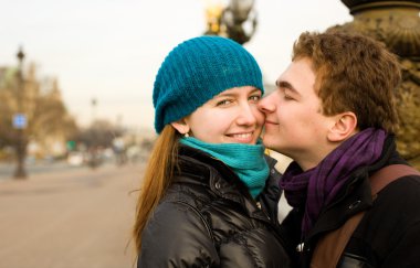 Happy loving couple in Paris at the Pont Alexand clipart