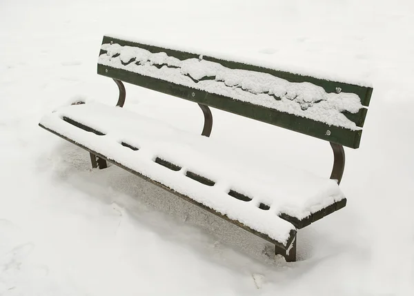 stock image Snow on the bench.