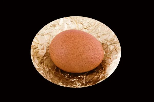 Egg on the foil. — Stock Photo, Image