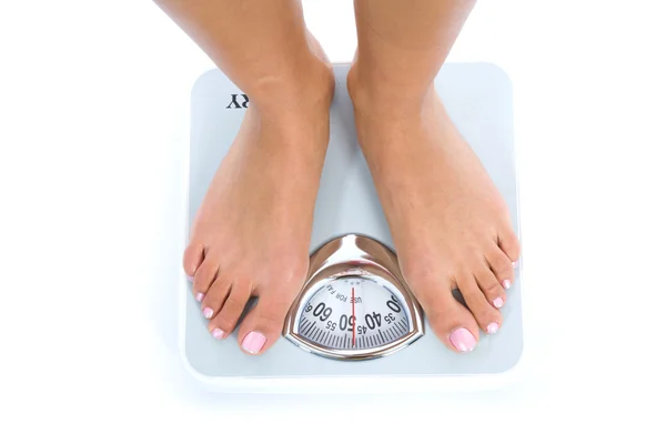 Mulher mostrando quanto peso ela lo — Fotografia de Stock