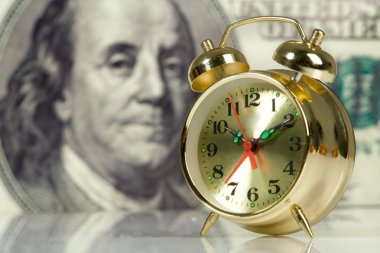 Clock on big dollar background clipart