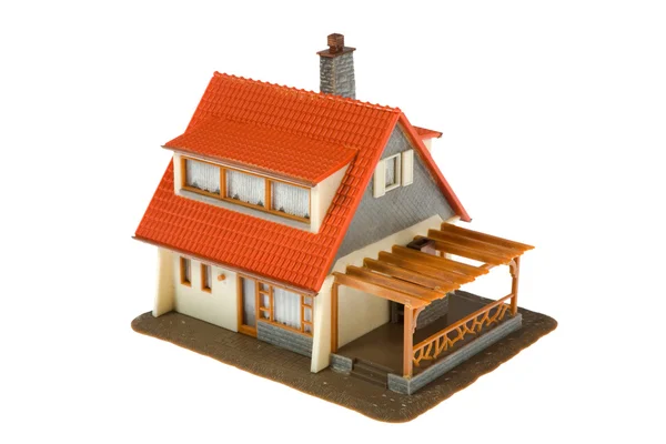 Casa in miniatura con dollari isolati — Foto Stock