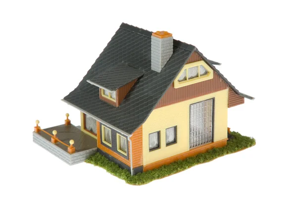 Miniature house with dollars isolated — Stock Photo, Image