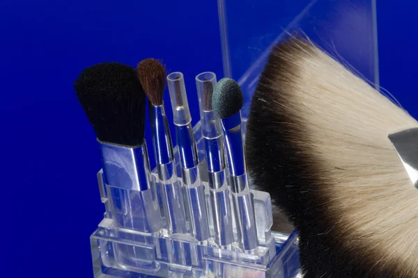 Make-up brushes on blue — Stock Photo, Image