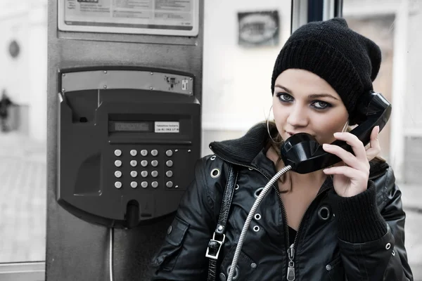 The young girl in telephone booth — Stock Photo, Image