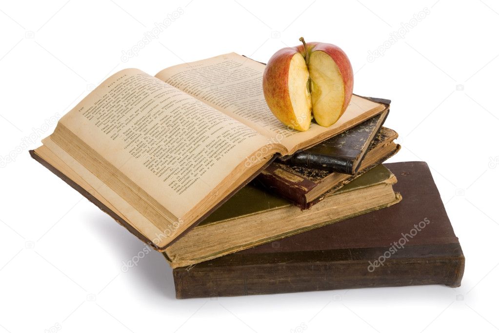 Apple on pile of old books