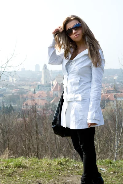 The young girl in a white raincoat — Stock Photo, Image
