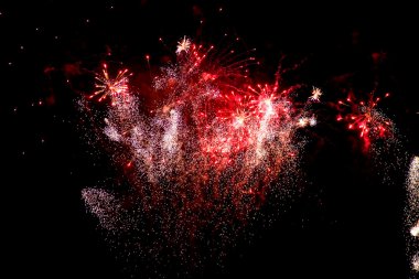 Colorful fireworks over a night sky clipart