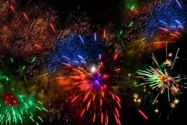 Colorful fireworks over a night sky — Stock Photo, Image
