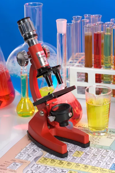 Laboratory ware and microscope — Stock Photo, Image