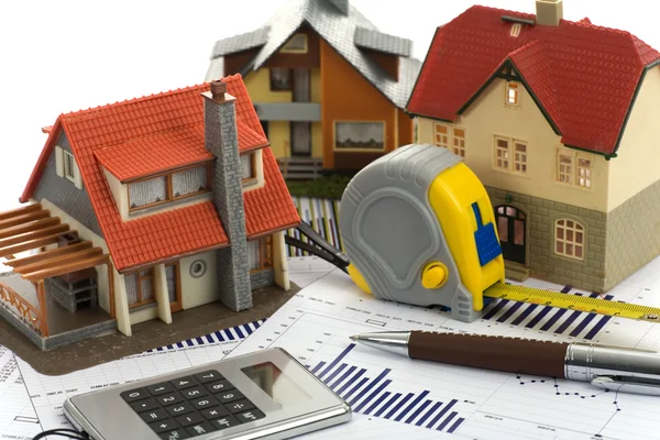 Model house and calculator — Stock Photo, Image