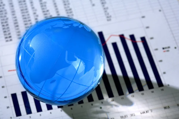 Diagram and glassy globe. — Stock Photo, Image