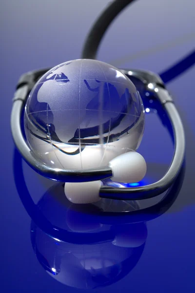 Glass globe with stethoscope — Stock Photo, Image