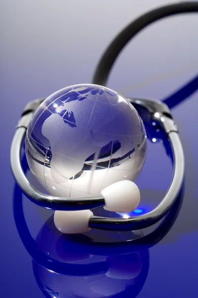 Glass globe with stethoscope — Stock Photo, Image