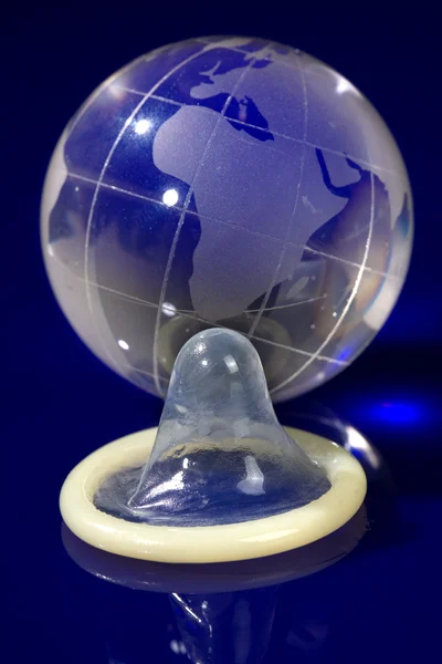 Glass globe withcondom — Stock Photo, Image