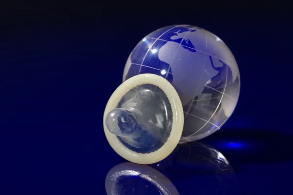 Glass globe withcondom — Stock Photo, Image