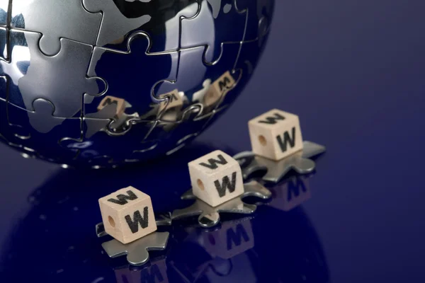 Globe puzzle on blue background — Stock Photo, Image