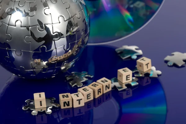 Puzzle Globus s cd — Stock fotografie
