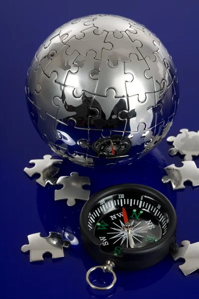 Puzzle Globus s kompasem — Stock fotografie