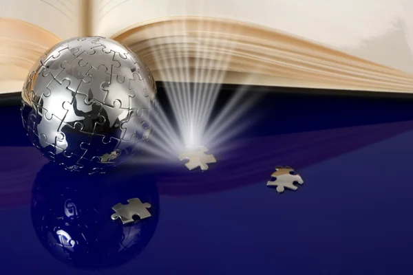 Globe puzzle with book — Stock Photo, Image