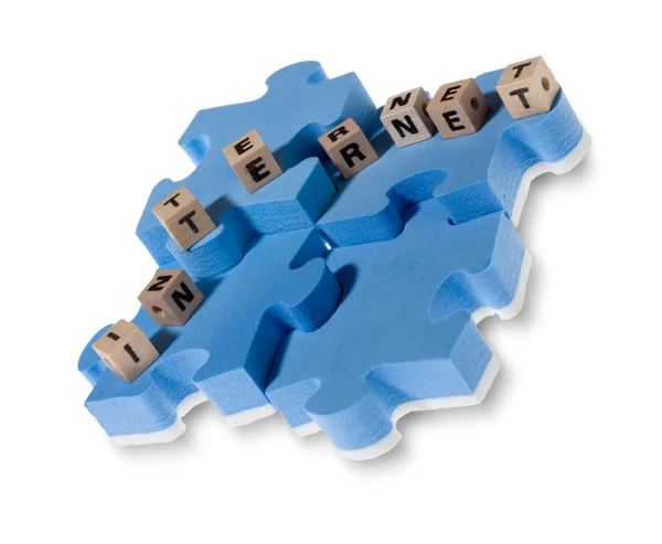 Puzzle azul con letra de madera —  Fotos de Stock