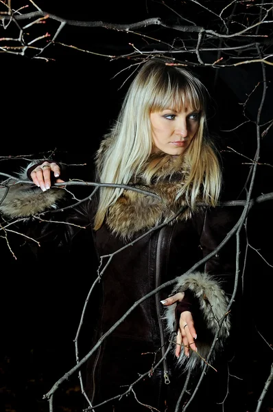 The beautiful girl in dark autumn wood — Stock Photo, Image