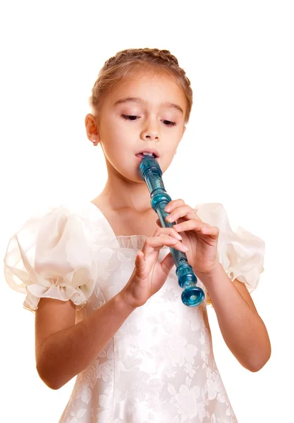 Little girl playing the flute — Stock Photo, Image